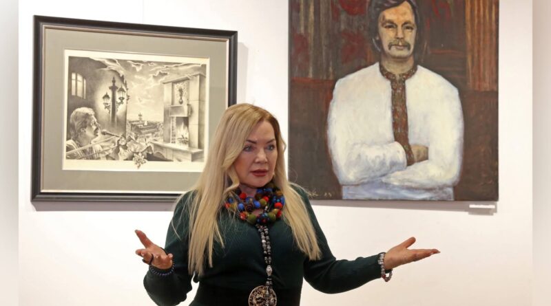 Art gallery with two paintings displayed.