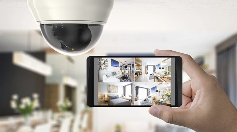 Hand holding phone viewing security camera